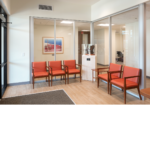 waiting lobby with orange chairs.